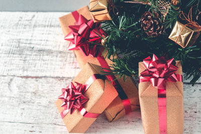 High angle view of christmas presents on wooden table