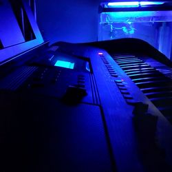 High angle view of illuminated piano