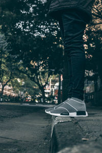 Low section of skateboarding on road