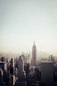 Modern buildings in city against sky