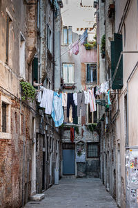 Narrow alley amidst buildings in city