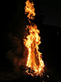 Close-up of bonfire against sky at night