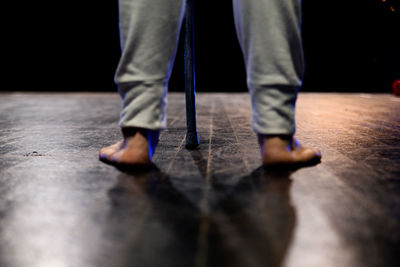 Low section of man standing on floor