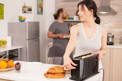 Friends cooking in kitchen