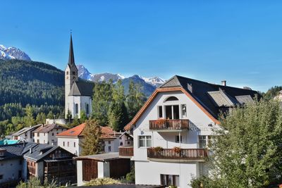 Houses in town against sky