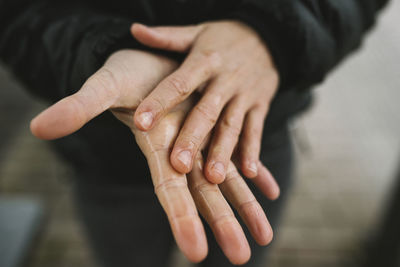 Cleaning hands with hand sanitizer