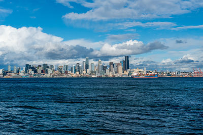 Clouds hang over skyscrapers in the skyline of seattle, washington.