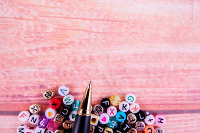 Directly above shot of pen and letters on table