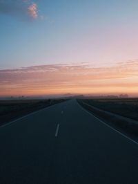 Road against sky during sunset