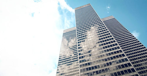 Low angle view of modern buildings against sky