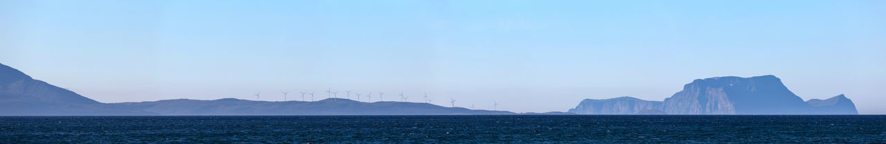 Sea with mountain in background