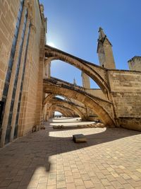 Low angle view of flying buttress at majorca cathedral up terrace .