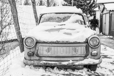 Close-up of abandoned car on snow