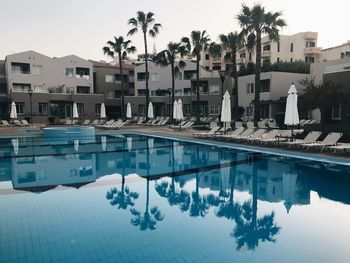 View of swimming pool against buildings