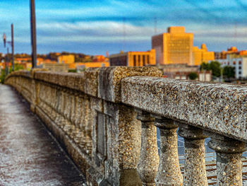 View of bridge and buildings against sky