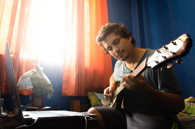 Young man playing guitar