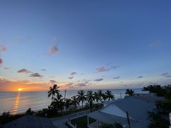 High angle view of sea and buildings against sky