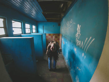 Full length of man standing in abandoned building