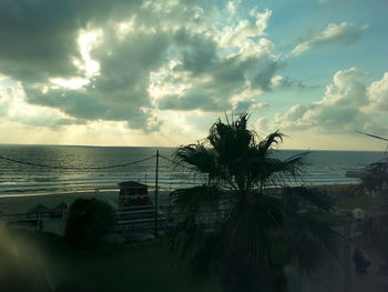 Scenic view of sea against cloudy sky