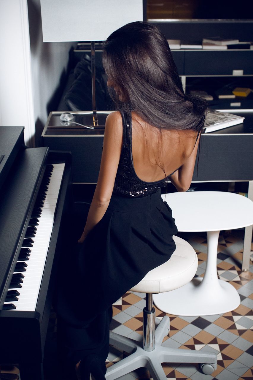 music, piano, piano key, musical instrument, pianist, practicing, playing, skill, keyboard instrument, sheet music, arts culture and entertainment, musician, one person, sitting, lifestyles, black color, indoors, performance, one woman only, classical music, adult, people, day, adults only, human body part, human hand