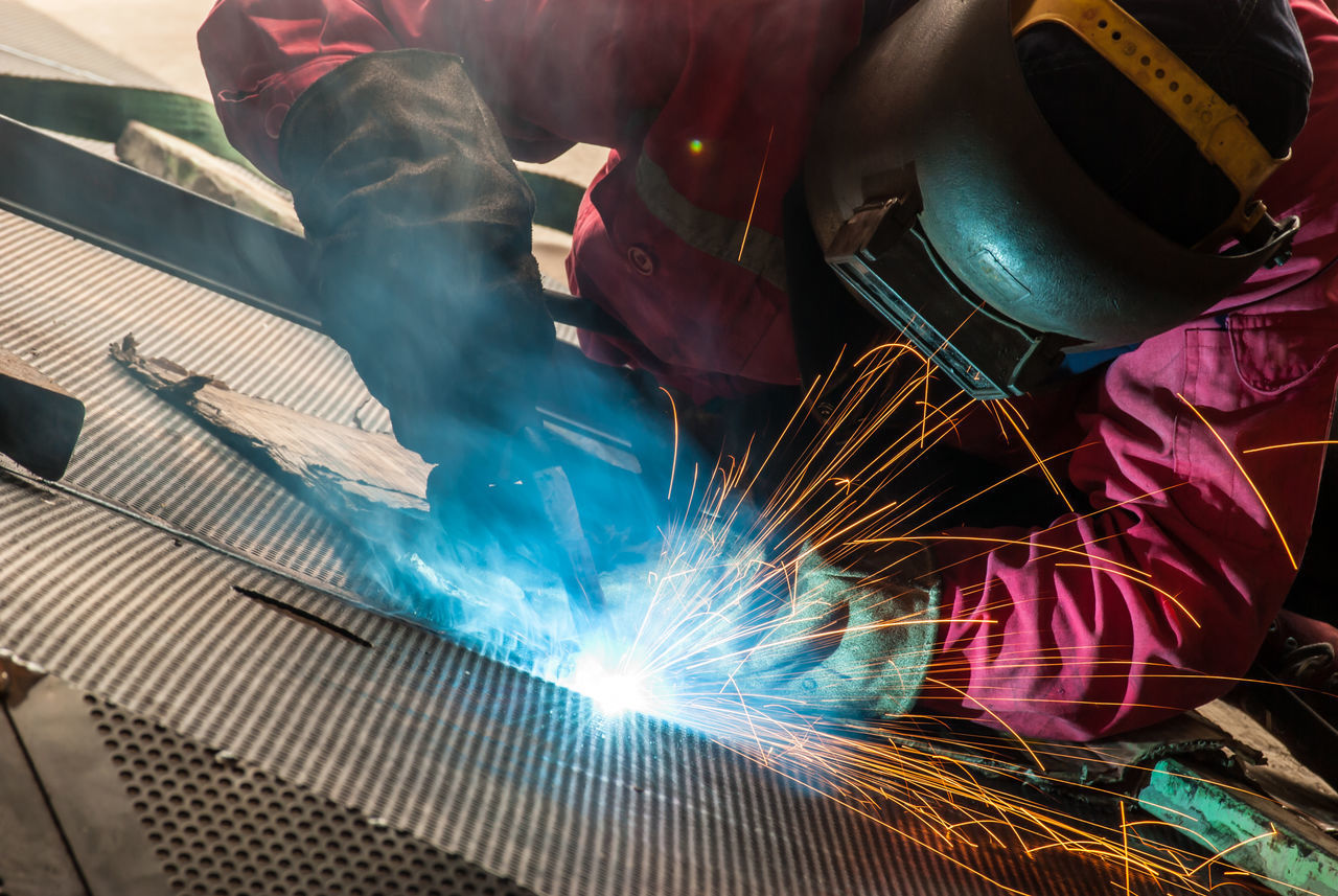 MAN WORKING AT FACTORY