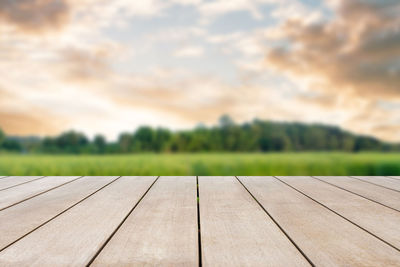 Close-up of boardwalk against sky