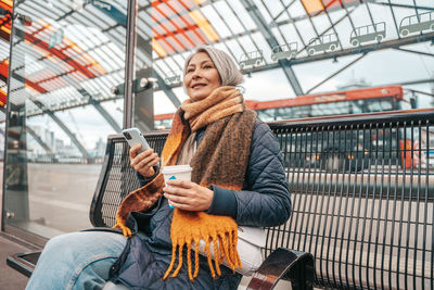 Portrait of young woman using mobile phone