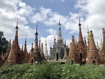 Panoramic view of temple and building against sky