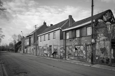 Street by building against sky