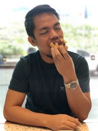 Young man eating food