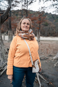 Portrait of woman standing in park