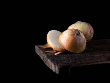 Close-up of onion against black background