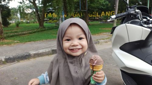 Portrait of cute girl eating ice cream