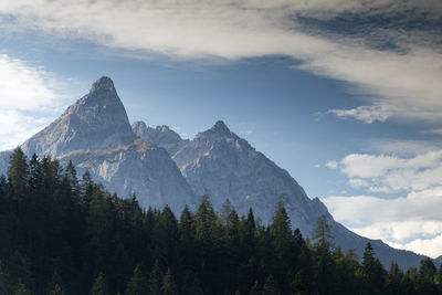 Scenic view of mountains against cloudy sky