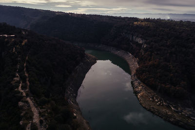 High angle view of arch bridge over river against sky