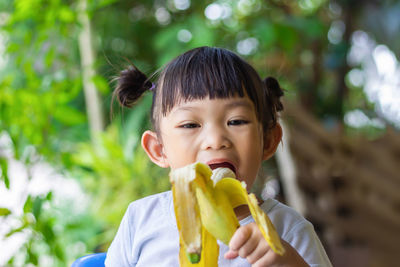 Portrait of boy eating food