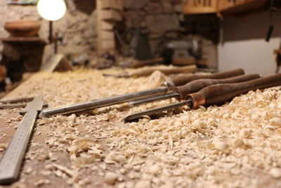 Close-up of tools on table in workshop