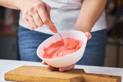 Midsection of person holding ice cream