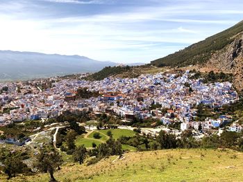 Aerial view of townscape against sky