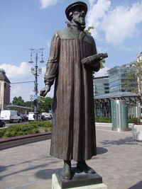 Statue against sky in city