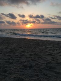 Scenic view of sea against sky during sunset