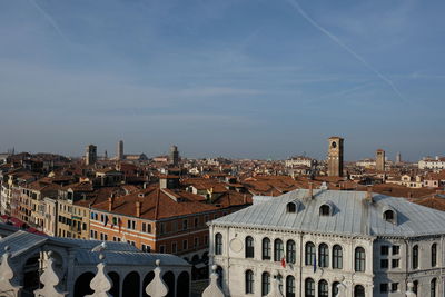 Buildings in city against sky