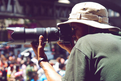 Man photographing in city