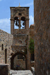 Low angle view of bell tower against sky