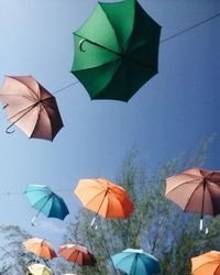 Multi colored umbrella against sky