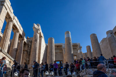 Athens greece - crowd of tourists near the entrance of acropolis propylaea