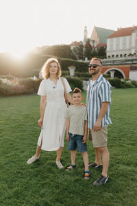 Full length of couple standing on field