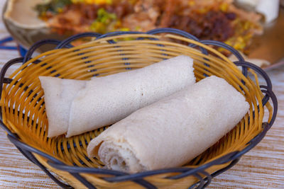 High angle view of ice cream in basket on table