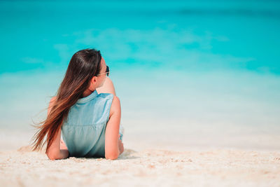 Woman sitting on beach