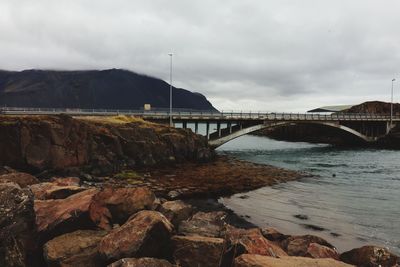 Bridge over river against sky